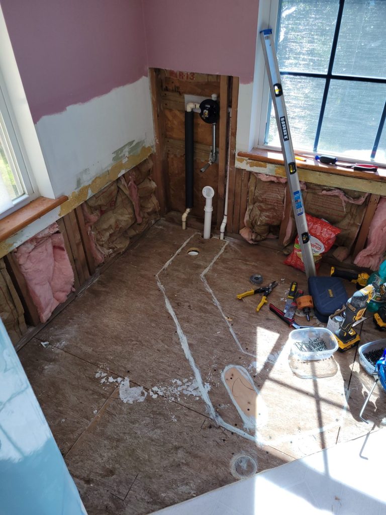 New PVC drain and supply lines run to the new tub location