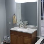 Finished Jack and Jill bathroom vanity with new mirror and LED light bar
